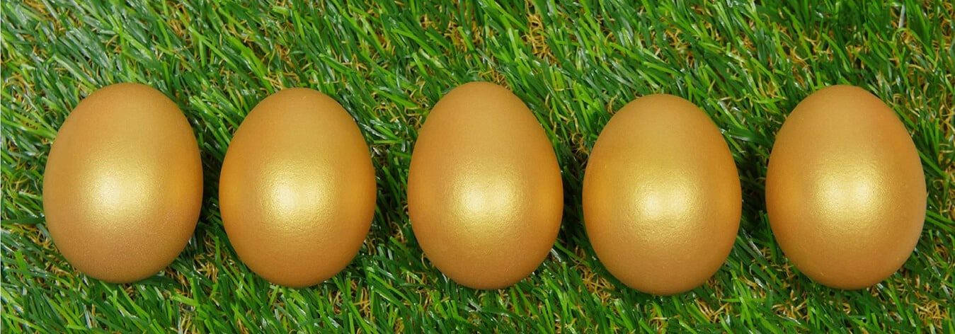 Golden eggs on grass